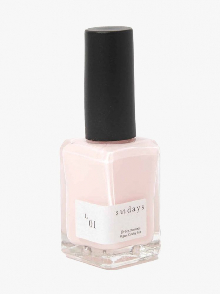 Sundays Nail Polish in L.01 bottle of light pink nail polish with black cap on light gray background
